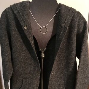 Wool sweater w/a hood & snap closers.